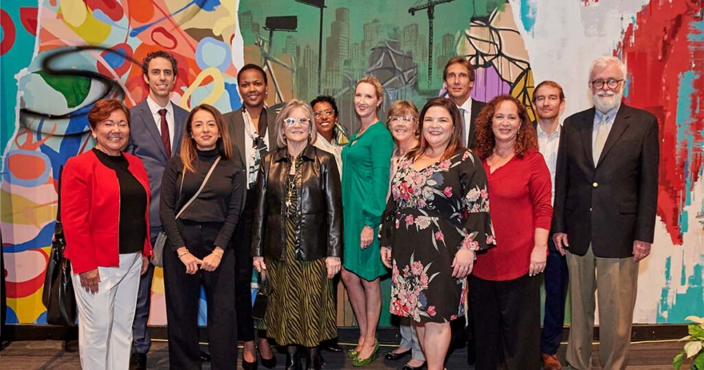 A group photo of team members of Florida Justice Institute at an event gala